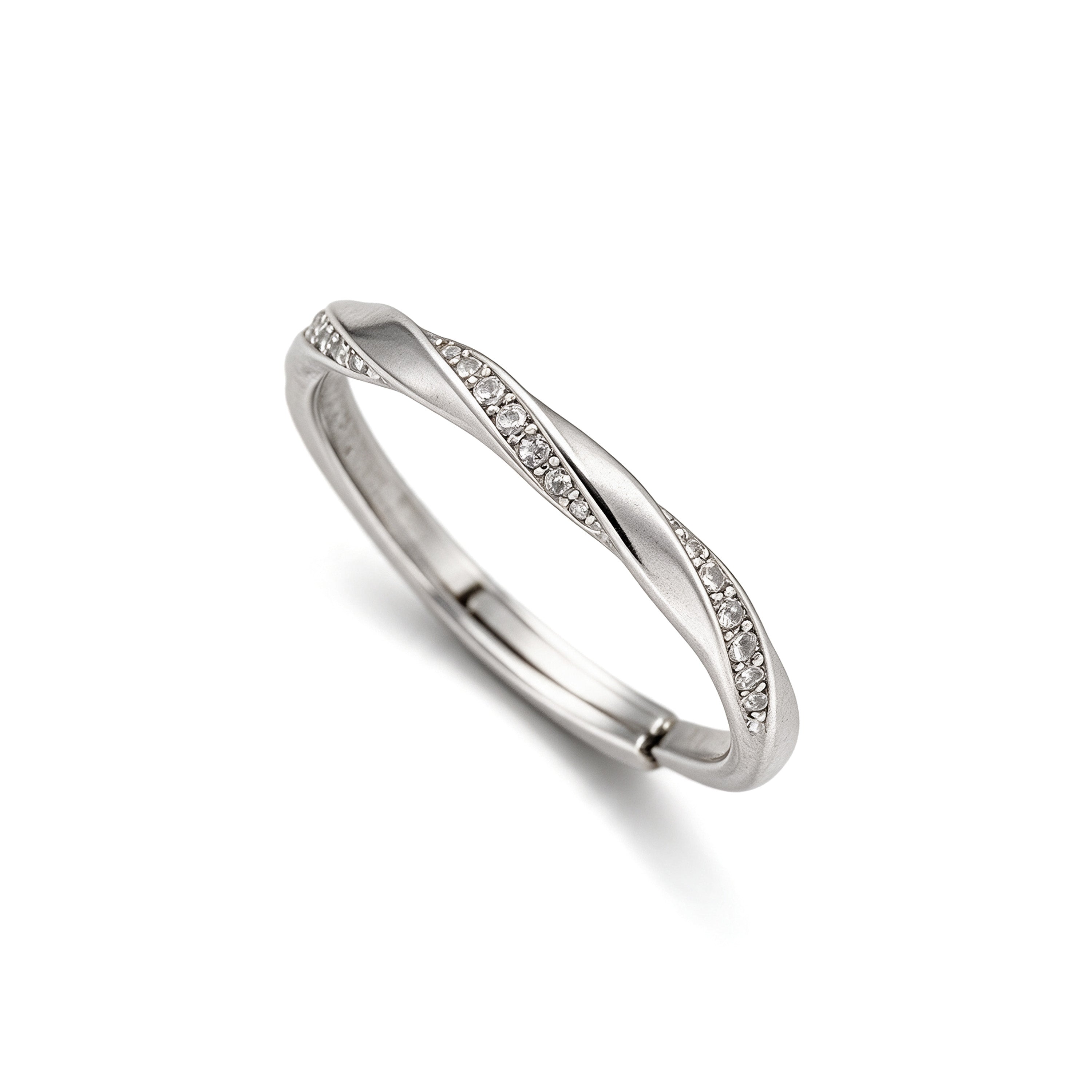 Angled view of adjustable silver plated twist ring with sparkling crystal accents