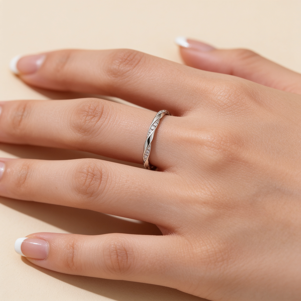 Adjustable silver plated crystal twist ring worn on hand showing its delicate sparkling design