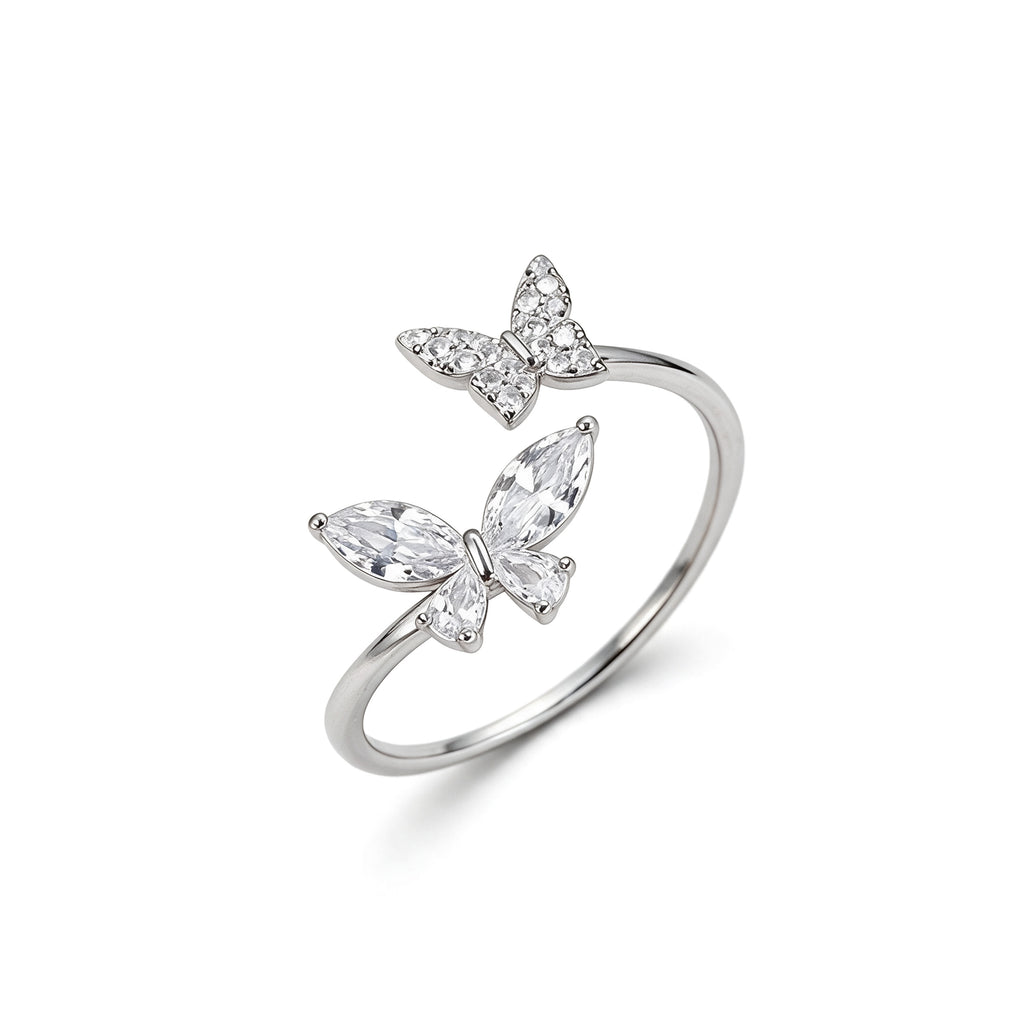 Adjustable silver plated double butterfly ring with sparkling cubic zirconia and crystal stones on white background