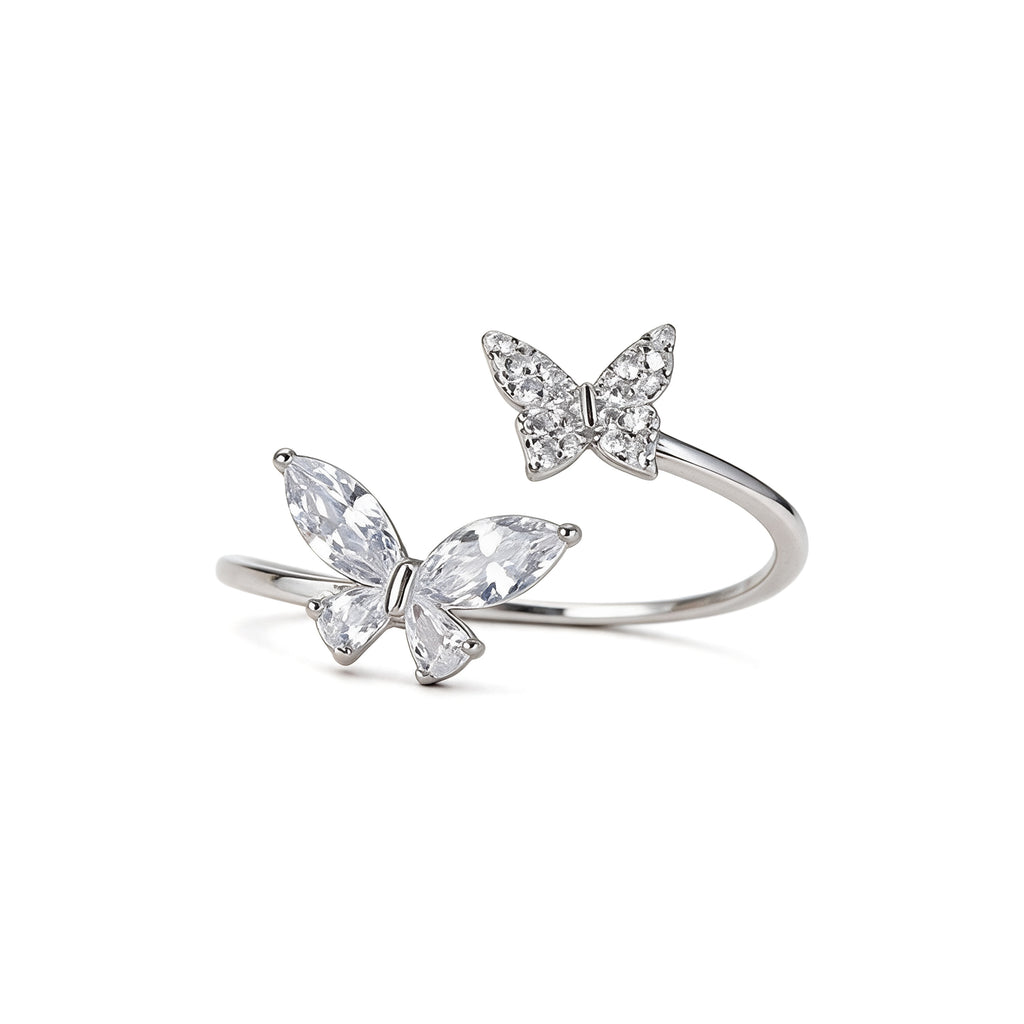 Adjustable silver plated double butterfly ring with sparkling cubic zirconia and crystal stones on white background