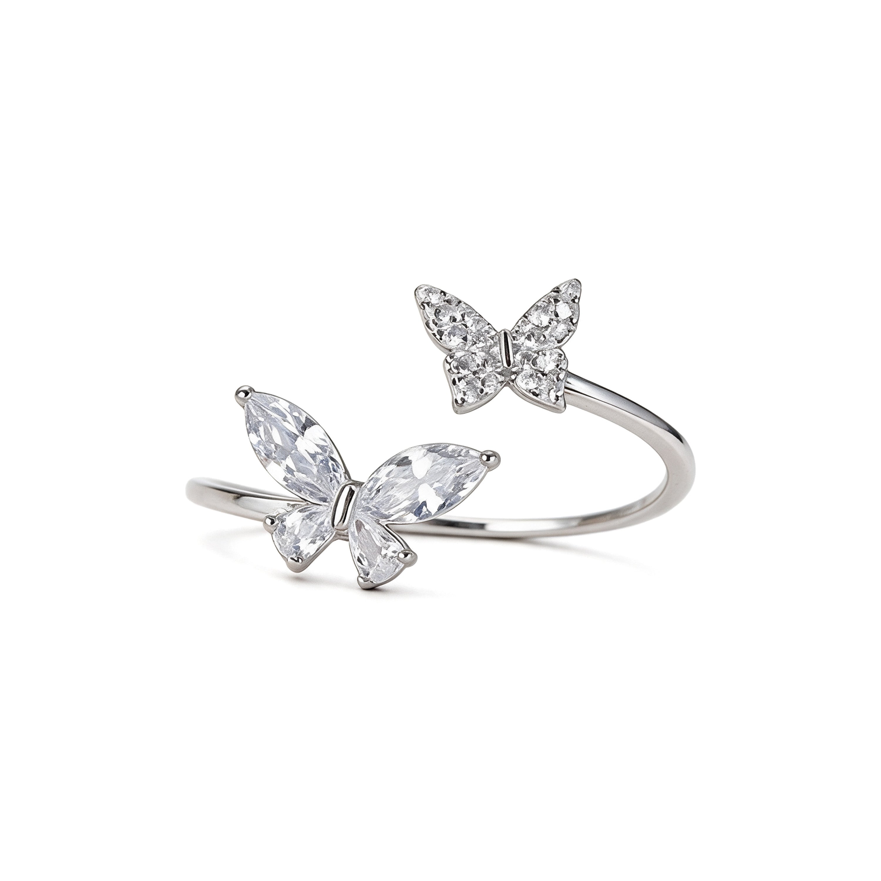Adjustable silver plated double butterfly ring with sparkling cubic zirconia and crystal stones on white background