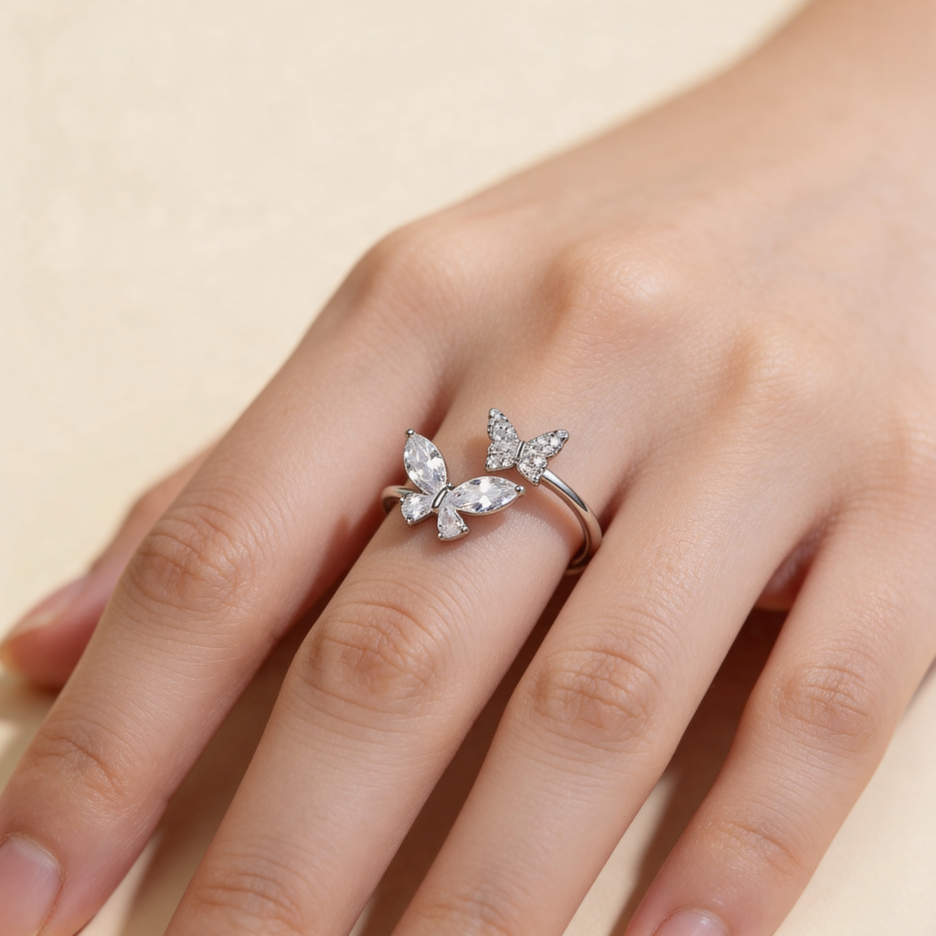 Adjustable silver plated double butterfly ring with sparkling cubic zirconia and crystal stones worn on hand