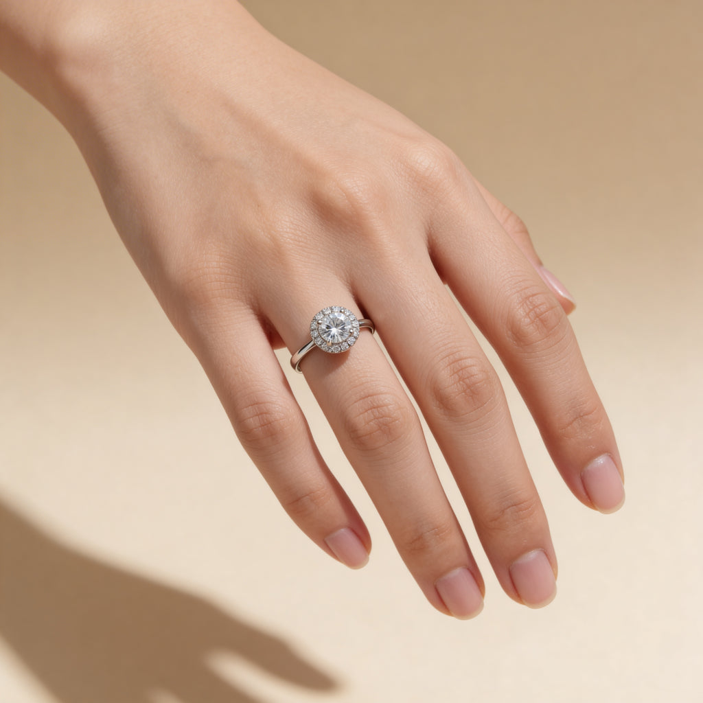 Adjustable silver cubic zirconia halo ring worn on hand, engagement-style jewelry