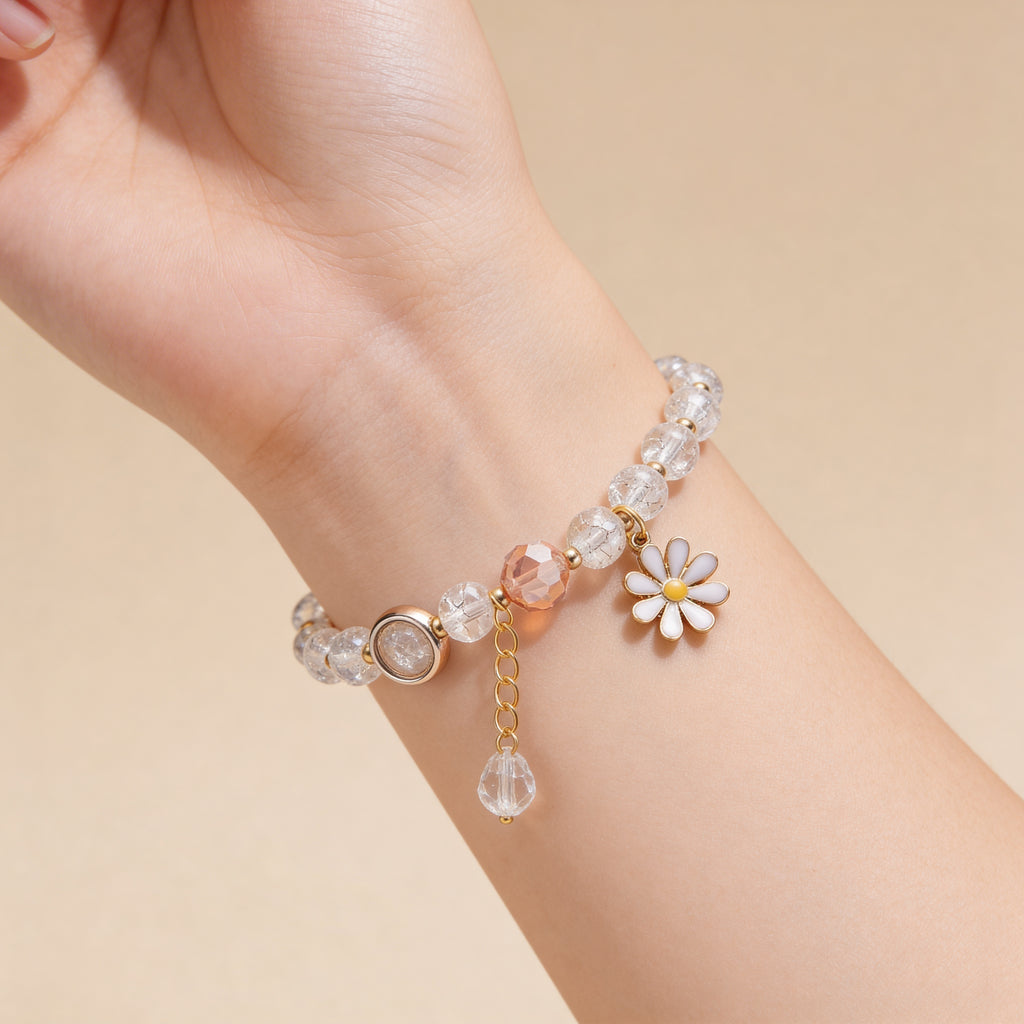 White beaded bracelet with daisy charm for children.