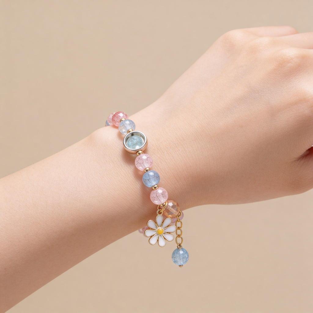 Pastel beaded bracelet with daisy charm for children.
