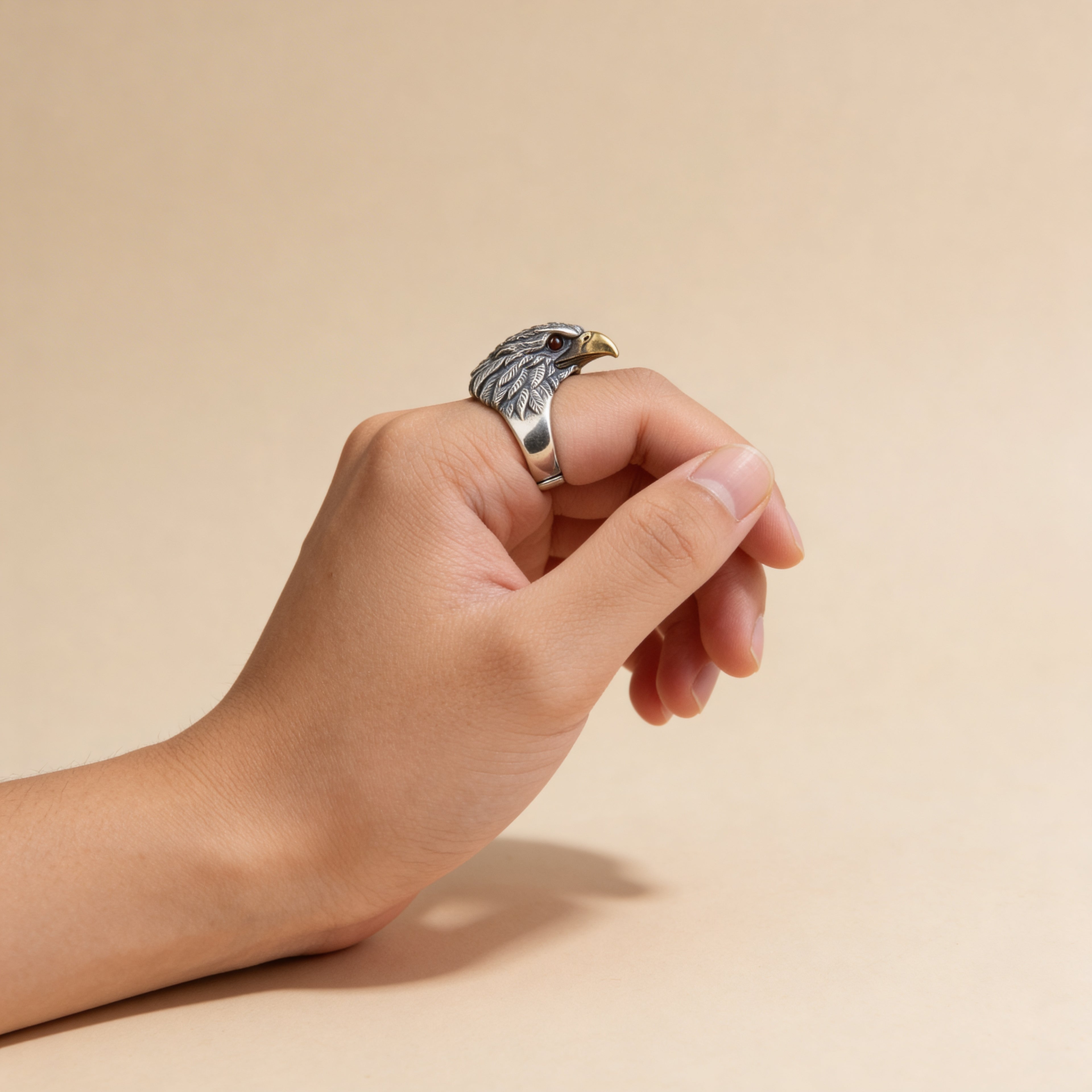 Adjustable silver eagle statement ring styled on hand.