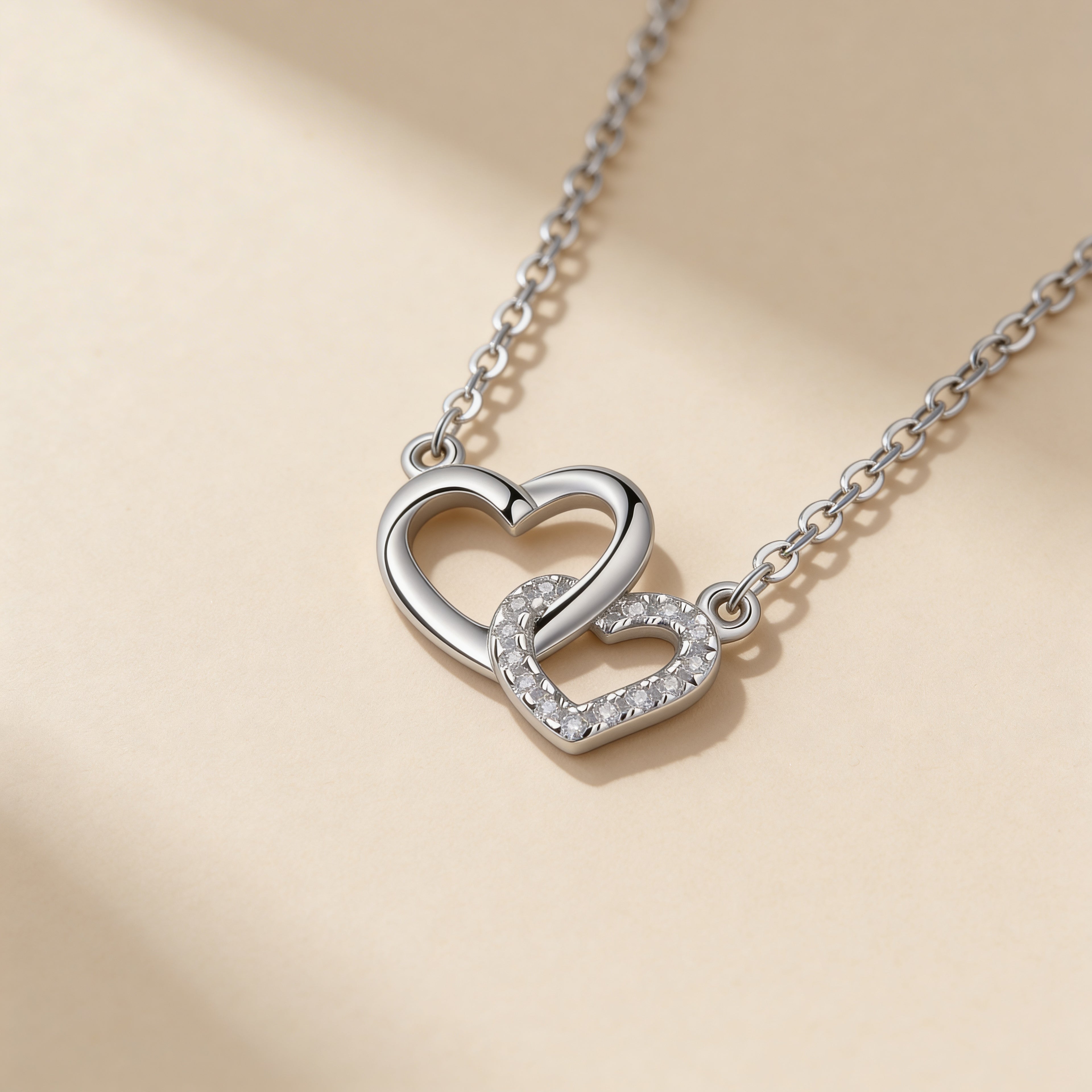 Sparkling crystal double heart necklace close-up.