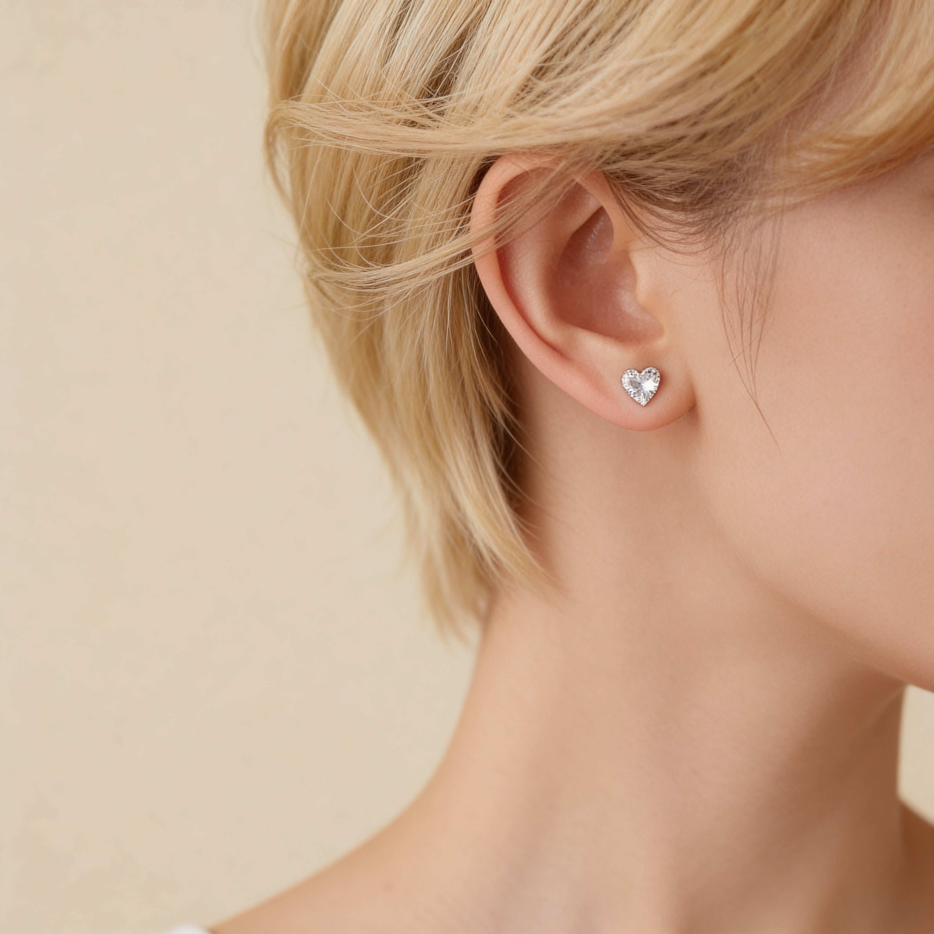 Cubic zirconia heart stud earrings silver setting.