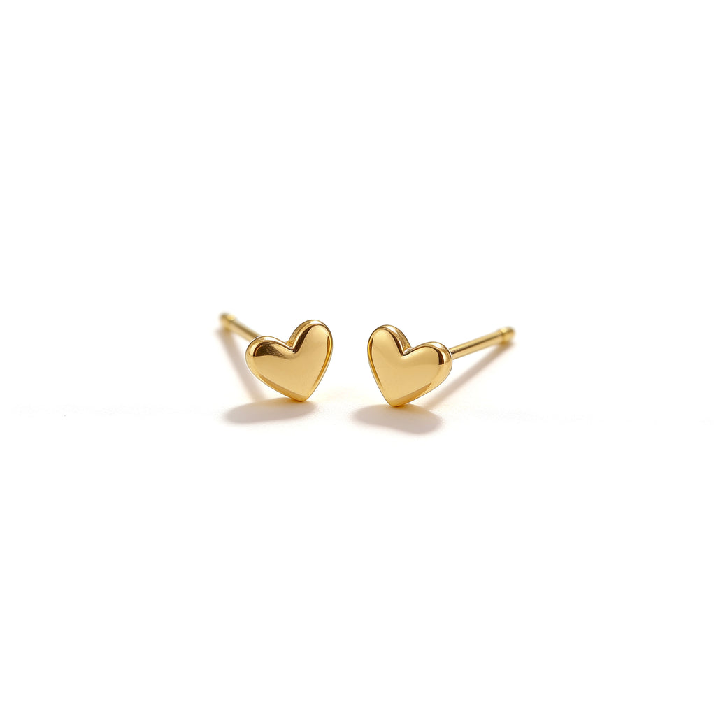 Pair of 4.8 mm gold tone mini heart stud earrings with a polished finish on a clean white background
