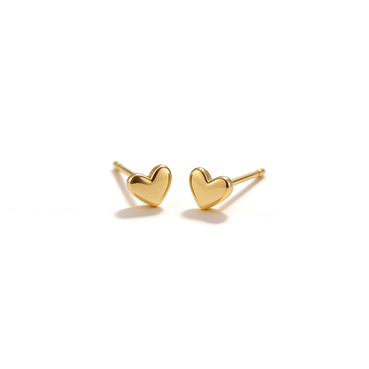 Pair of 4.8 mm gold tone mini heart stud earrings with a polished finish on a clean white background