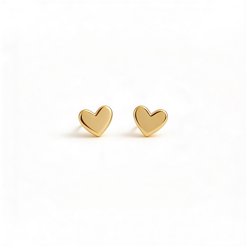 Gold tone mini heart stud earrings with a polished finish on a white background