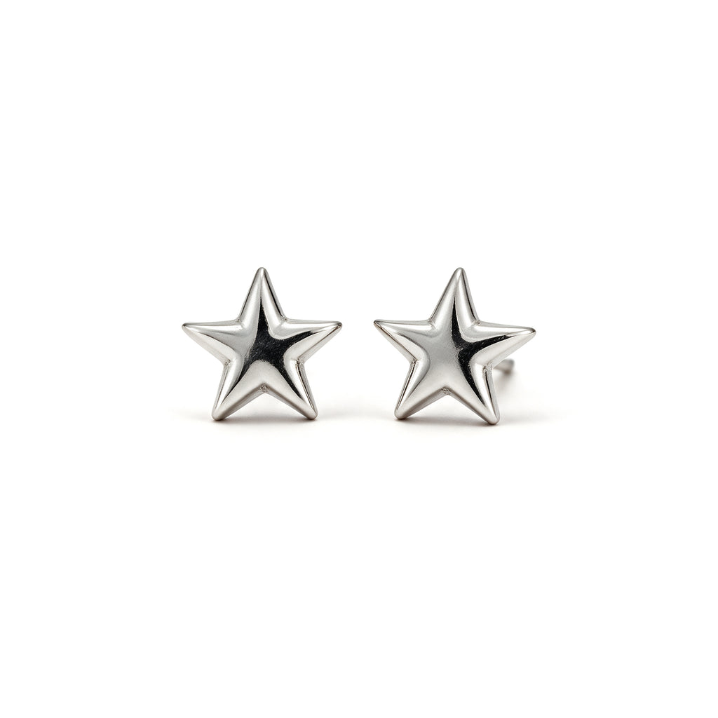 Mini silver plated star stud earrings on a white background