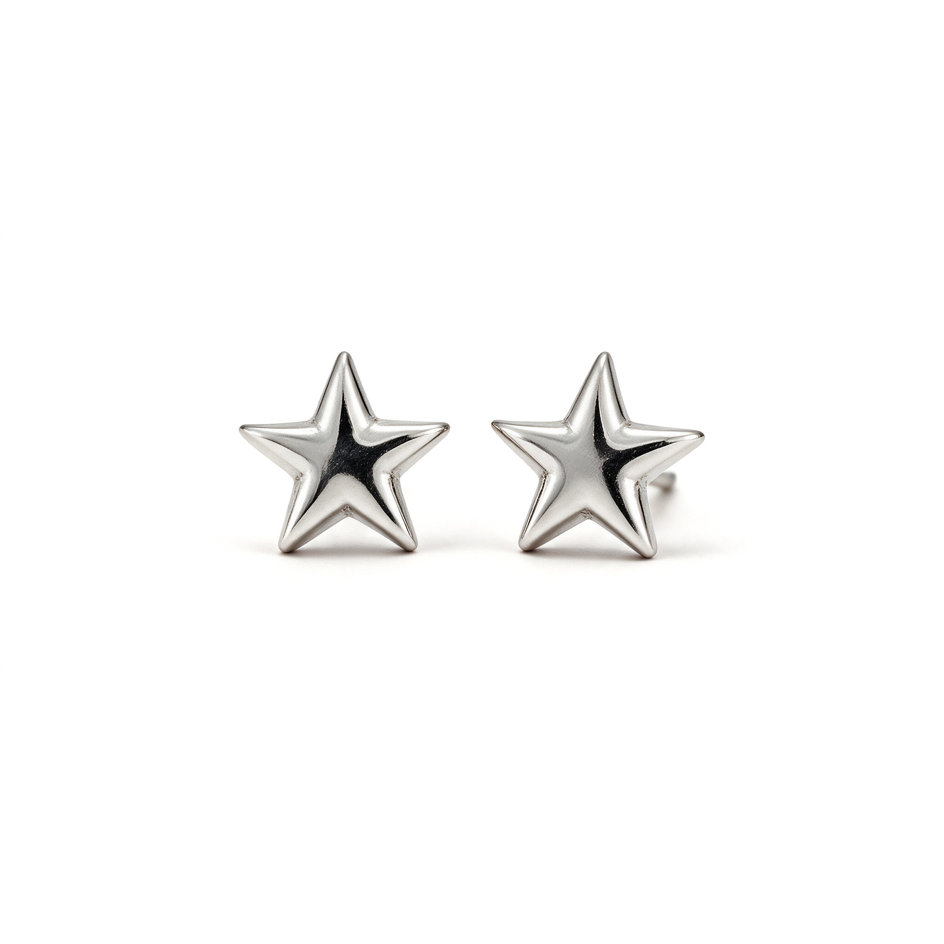 Mini silver plated star stud earrings on a white background