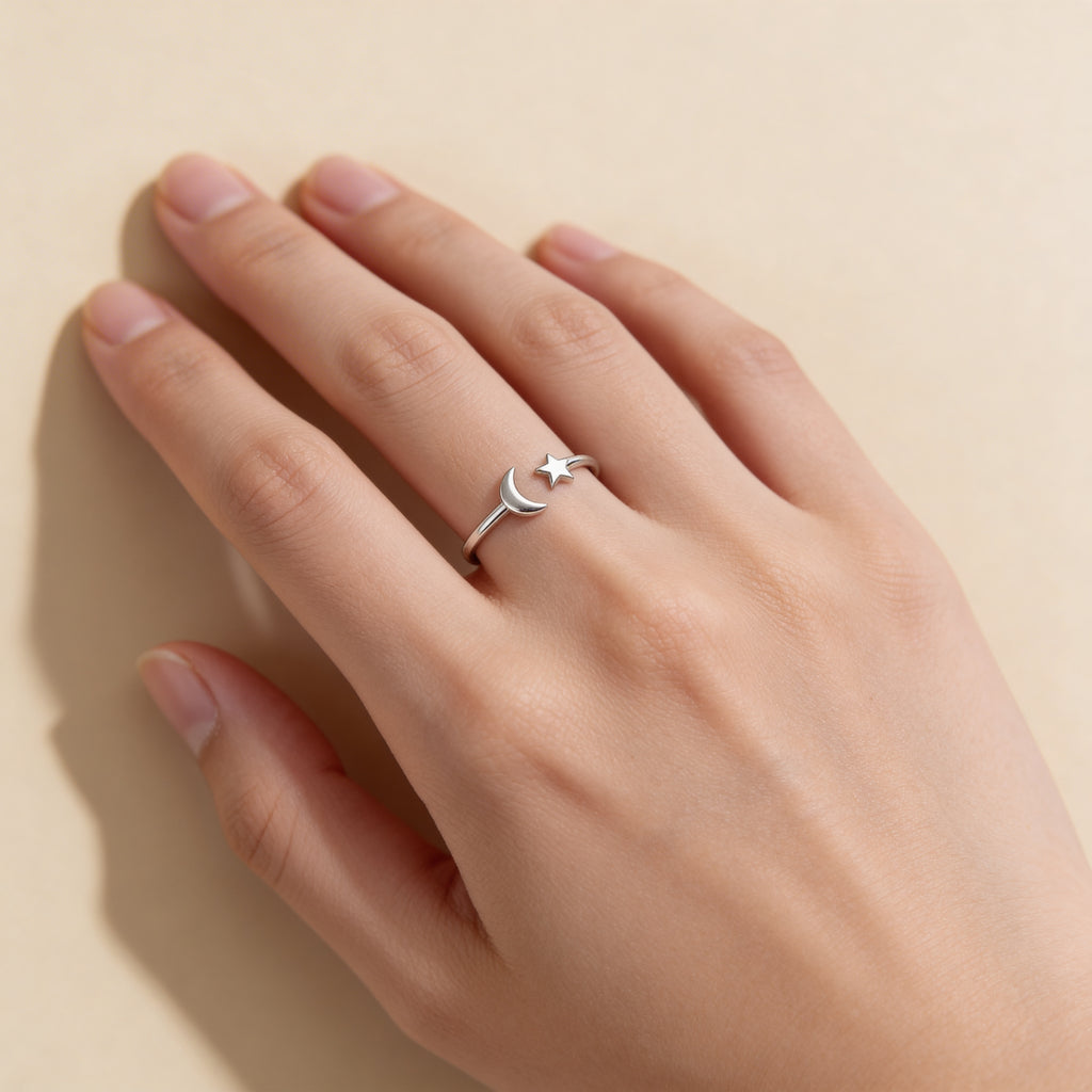 Silver moon and star adjustable ring worn on hand, dainty celestial jewellery