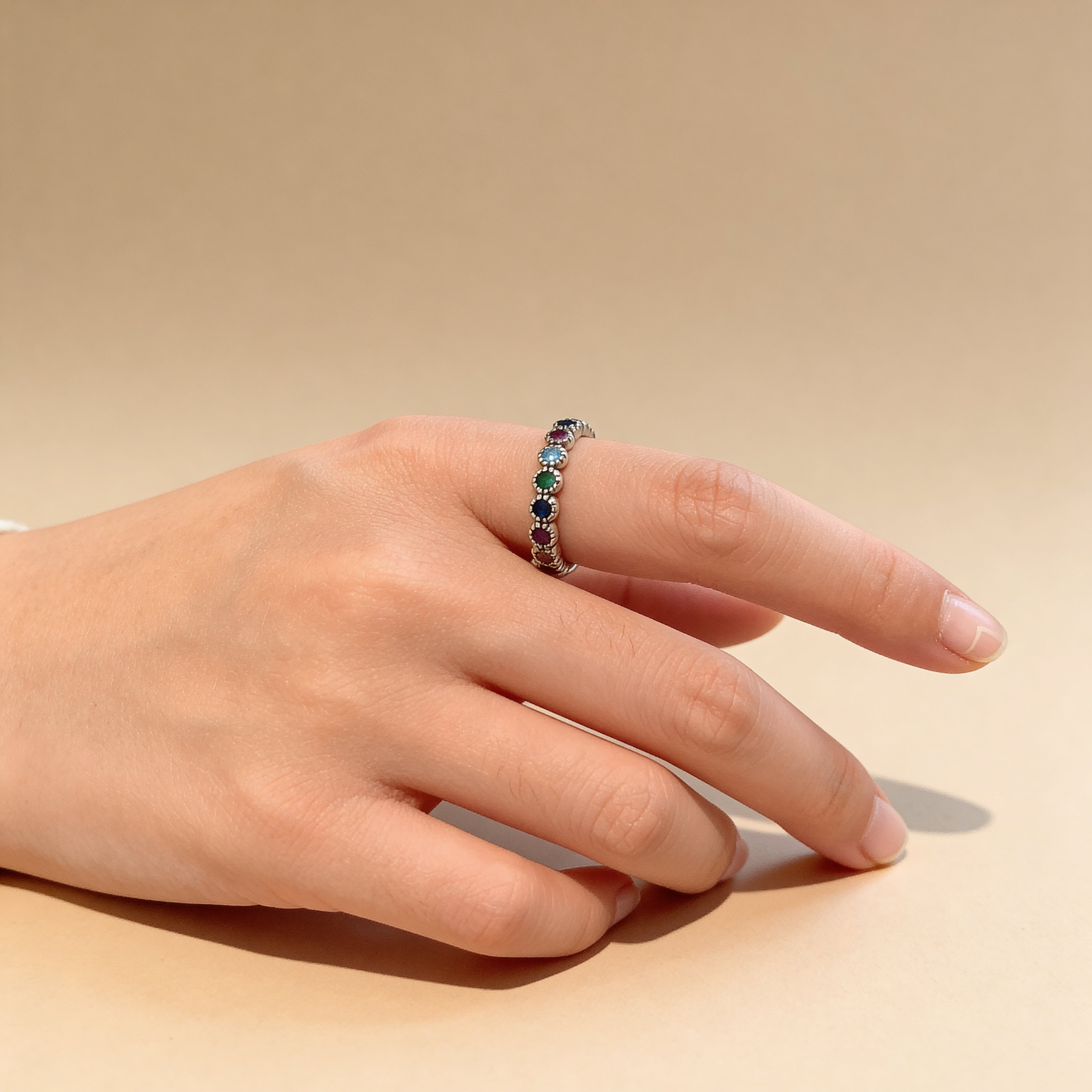 Multicolor diamante silver band ring styled on hand, colorful adjustable jewelry.