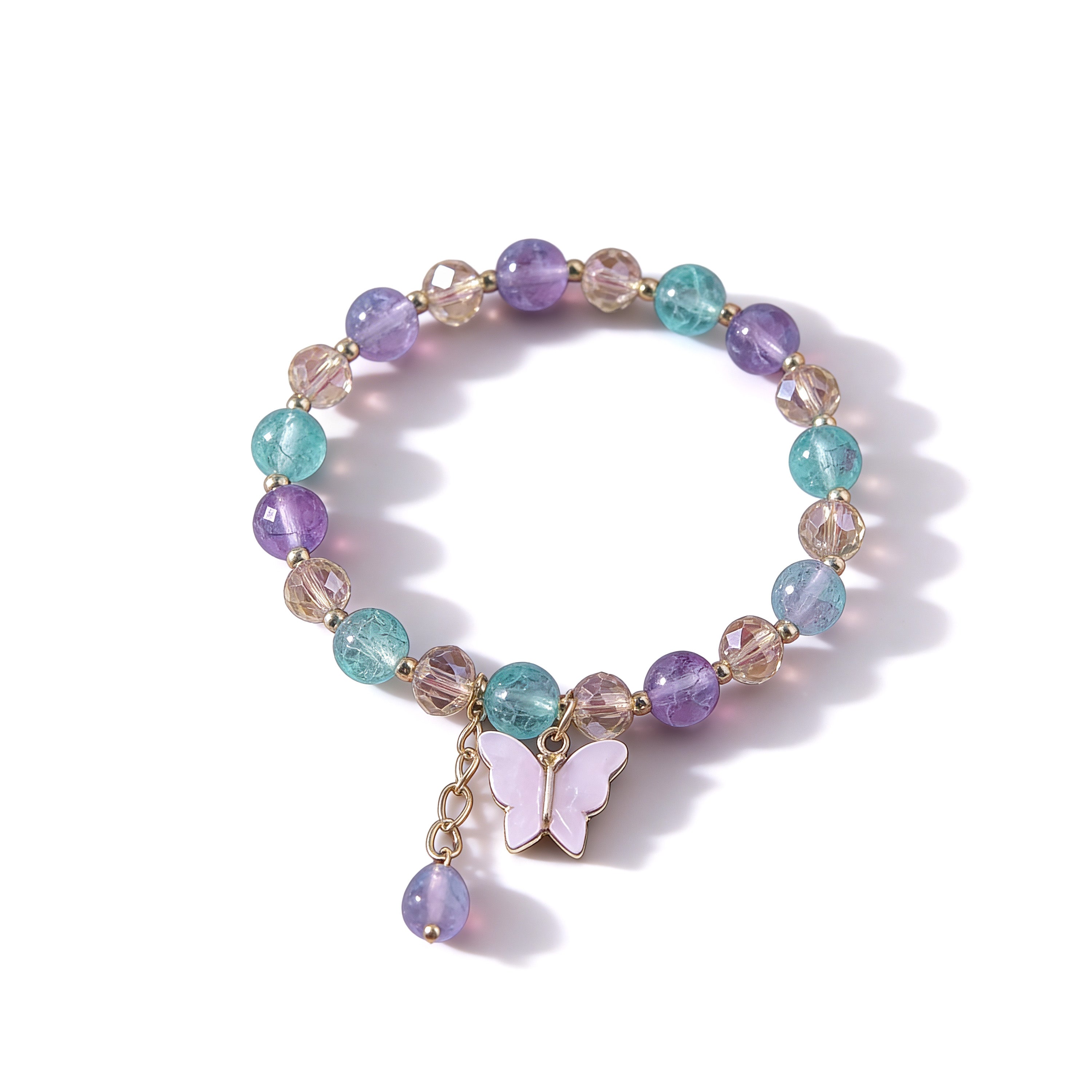 Multicolored beaded bracelet with a butterfly charm on a white background