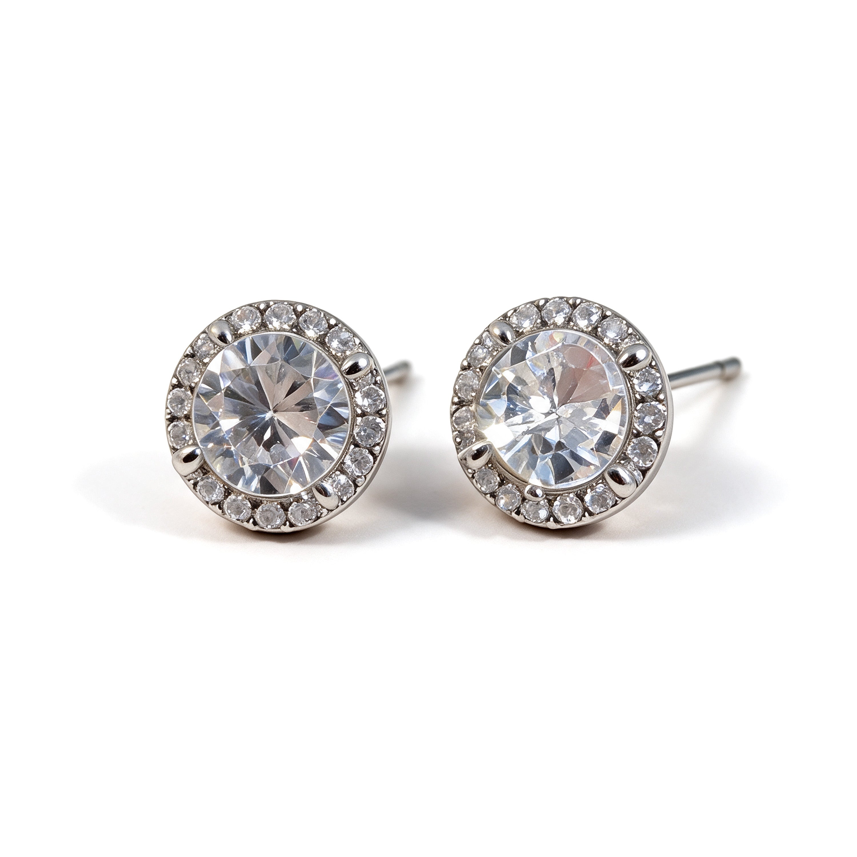 Round silver plated cubic zirconia stud earrings with a sparkling crystal halo on a white background
