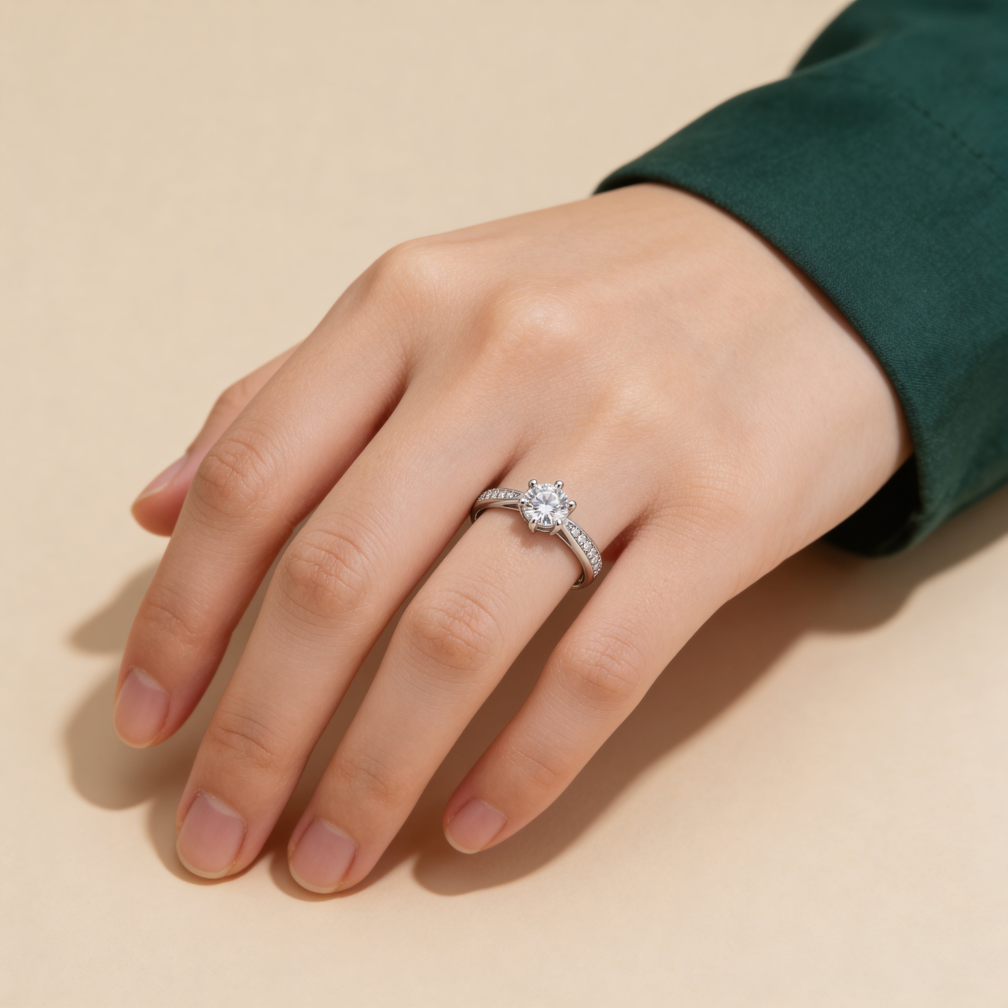 Adjustable silver solitaire ring worn on hand, engagement-style cubic zirconia ring for women.