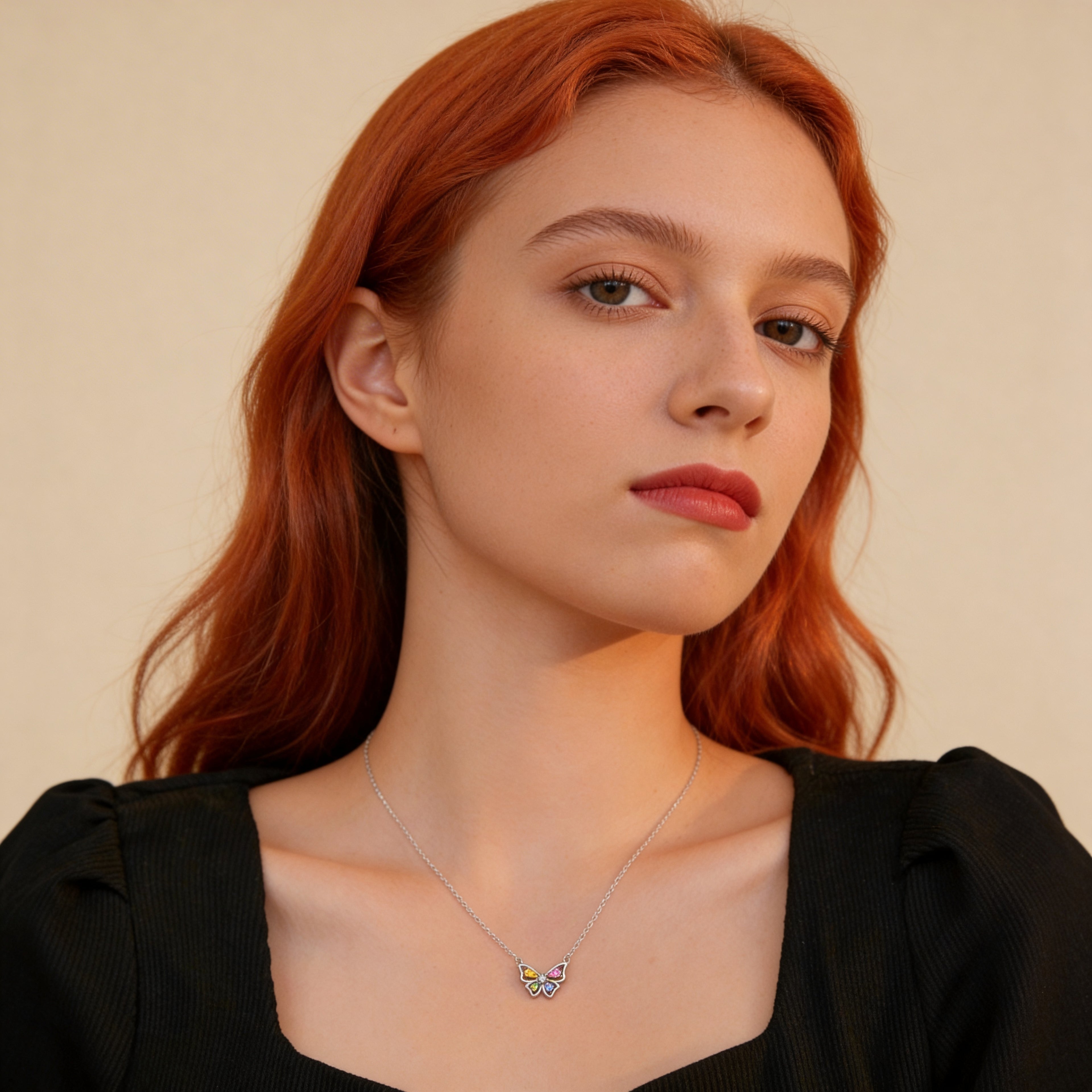 Colorful butterfly pendant necklace worn on neck.