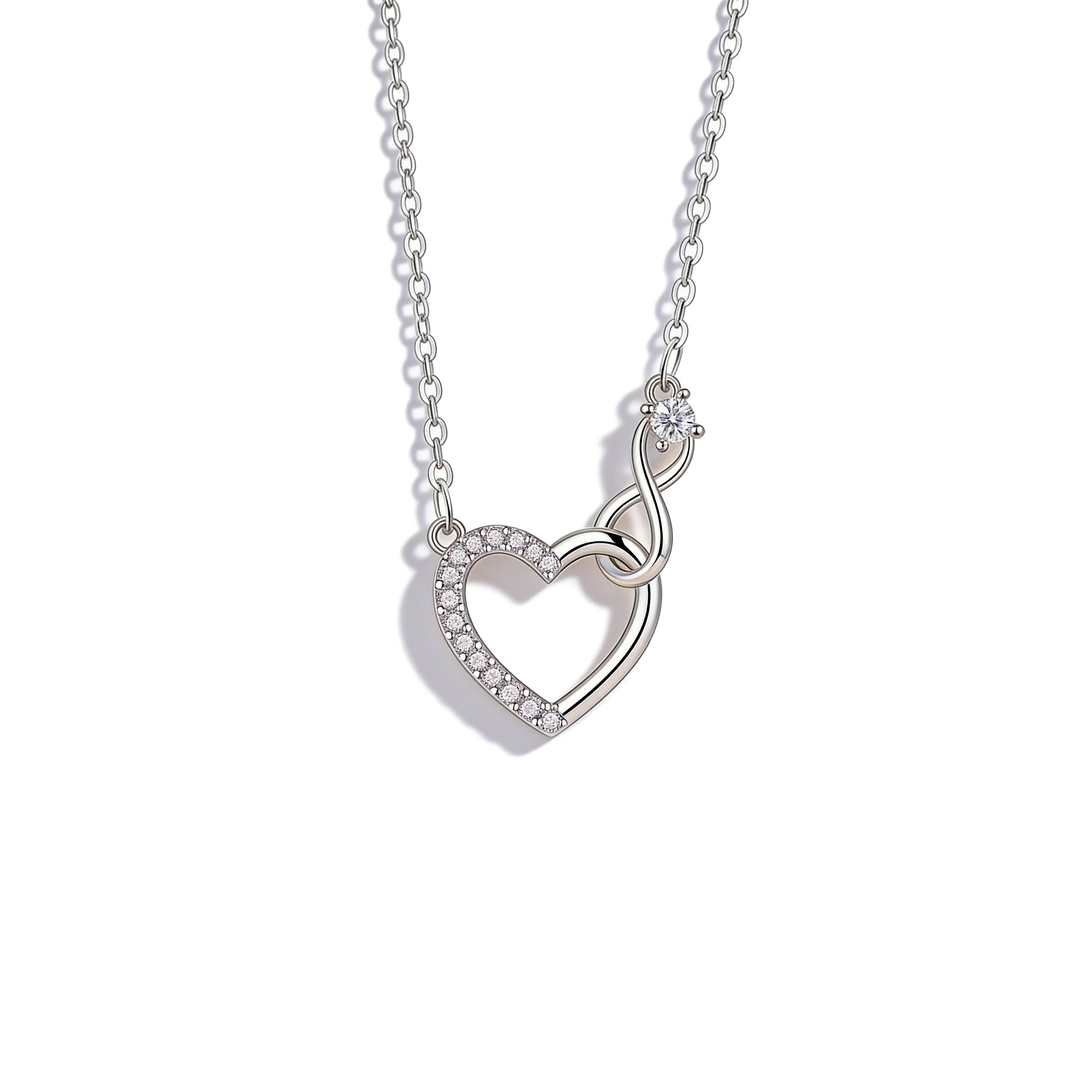 Silver plated crystal heart pendant necklace with CZ center stone.