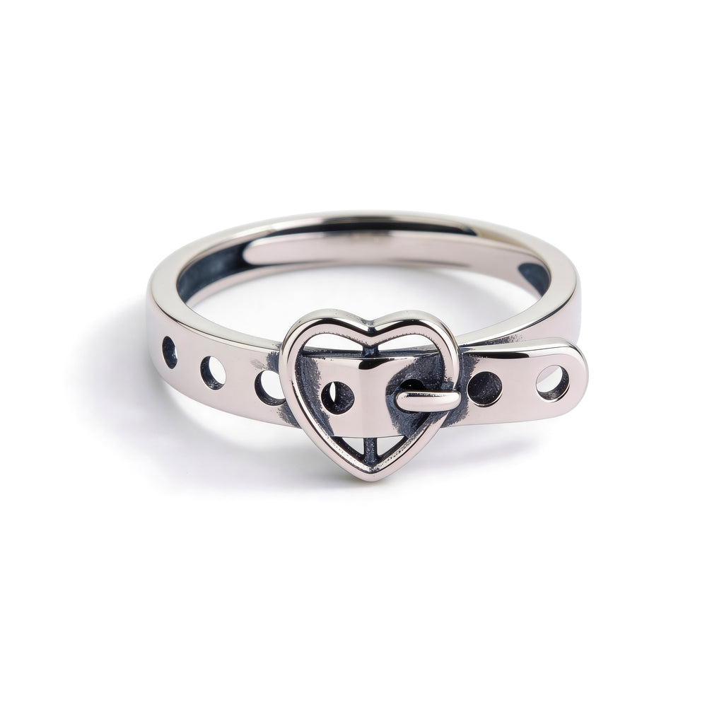 Silver ring with a heart-shaped design on a white background