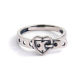 Silver ring with a heart-shaped design on a white background