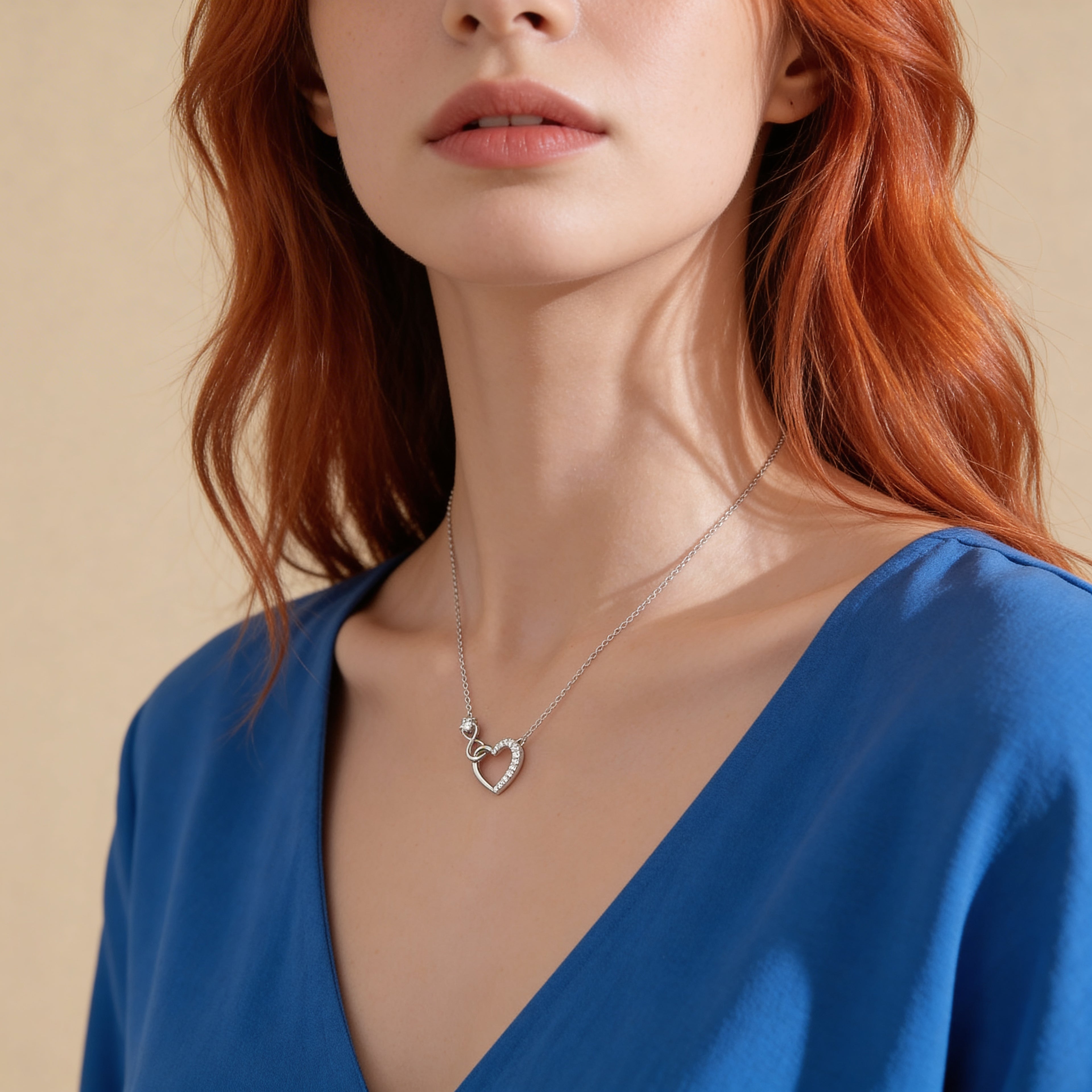 Crystal heart necklace worn by model.