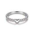 Silver plated adjustable open heart ring with cubic zirconia stones.