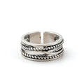 Silver plated adjustable braided rope ring with twisted layered band design.