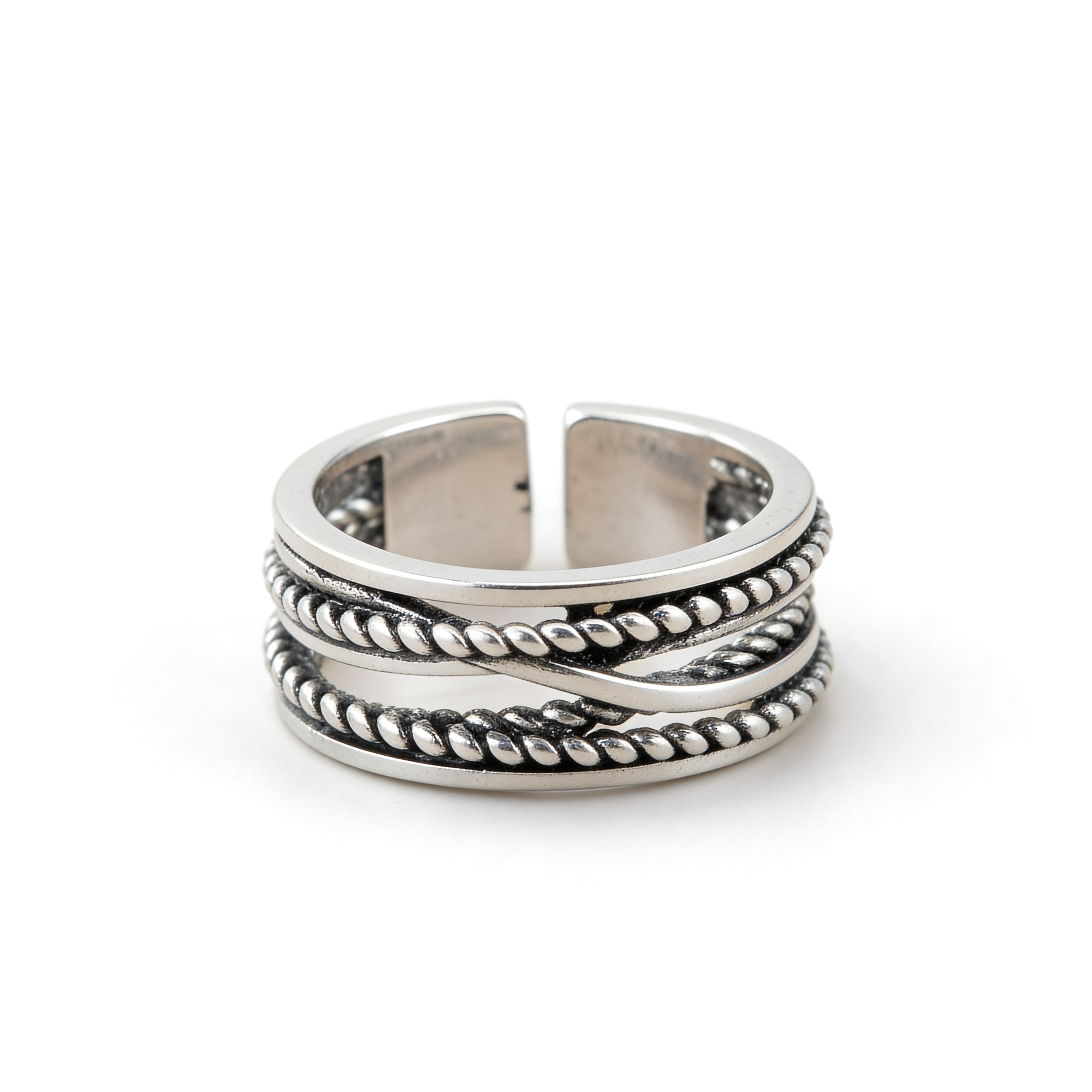 Silver plated adjustable braided rope ring with twisted layered band design.