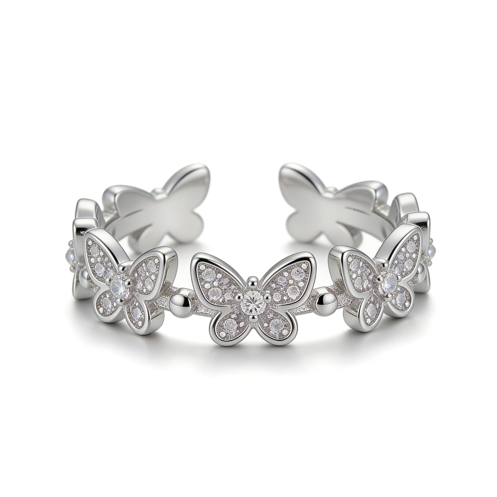 Silver plated adjustable butterfly ring with cubic zirconia stones.