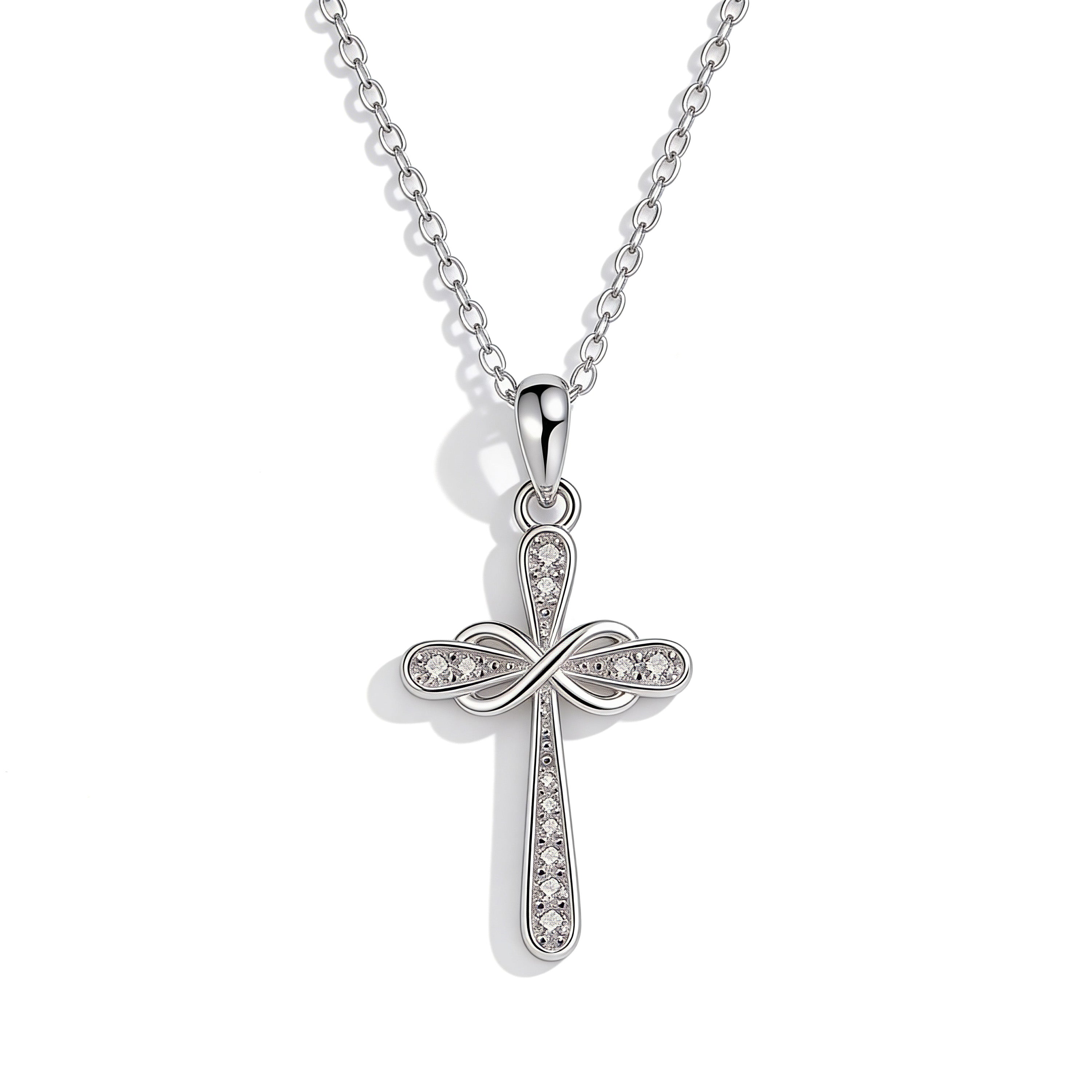 Silver plated crystal cross pendant necklace.