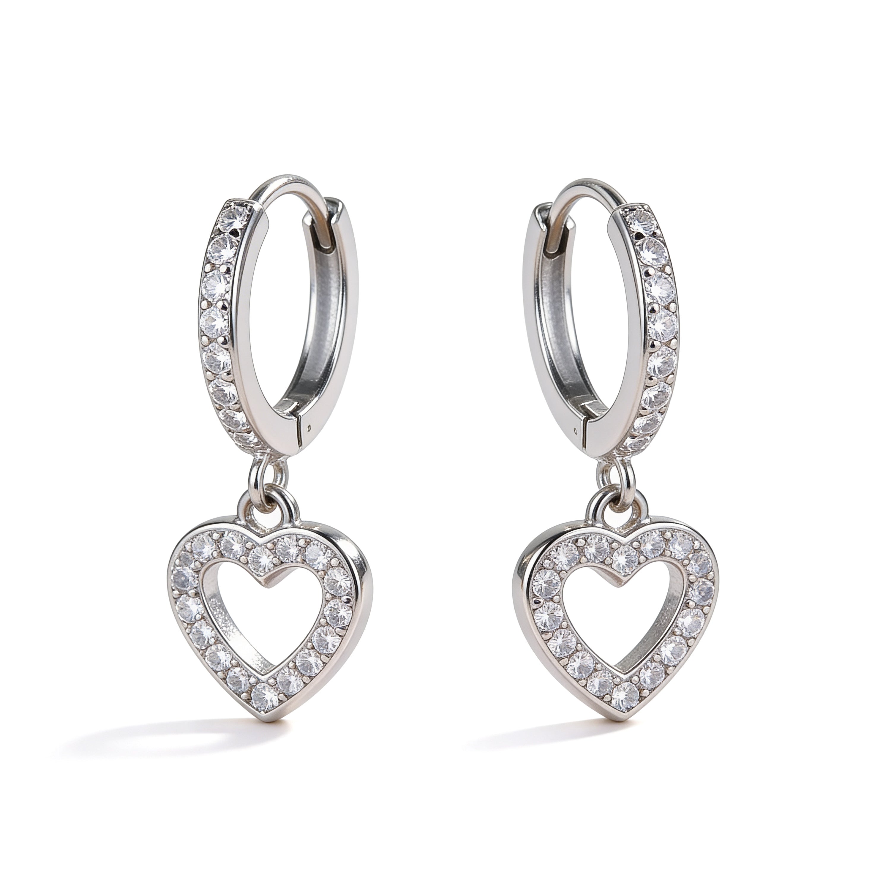 Silver crystal heart hoop earrings with CZ detailing.
