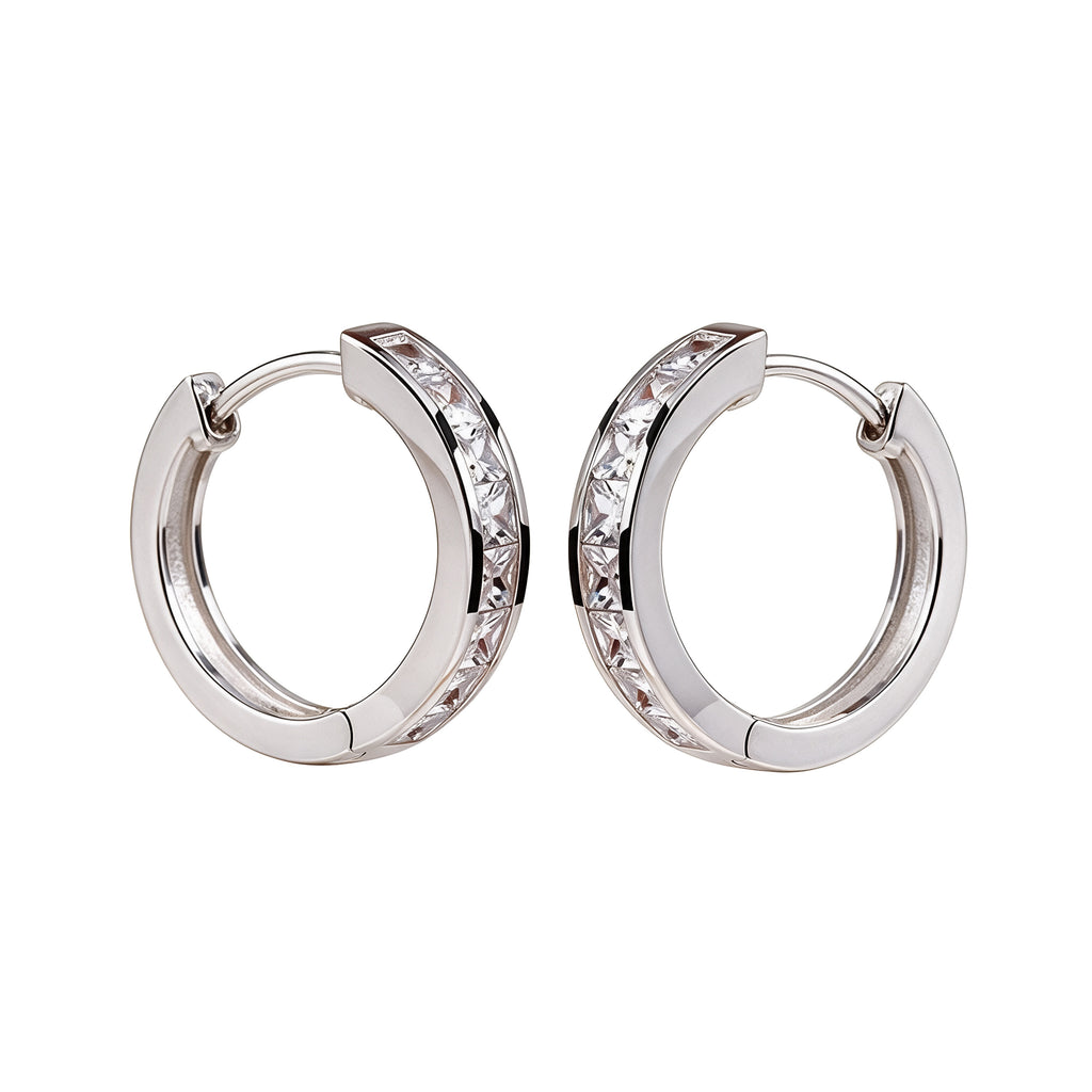 Silver plated crystal huggie hoop earrings with sparkling stones on a clean white background