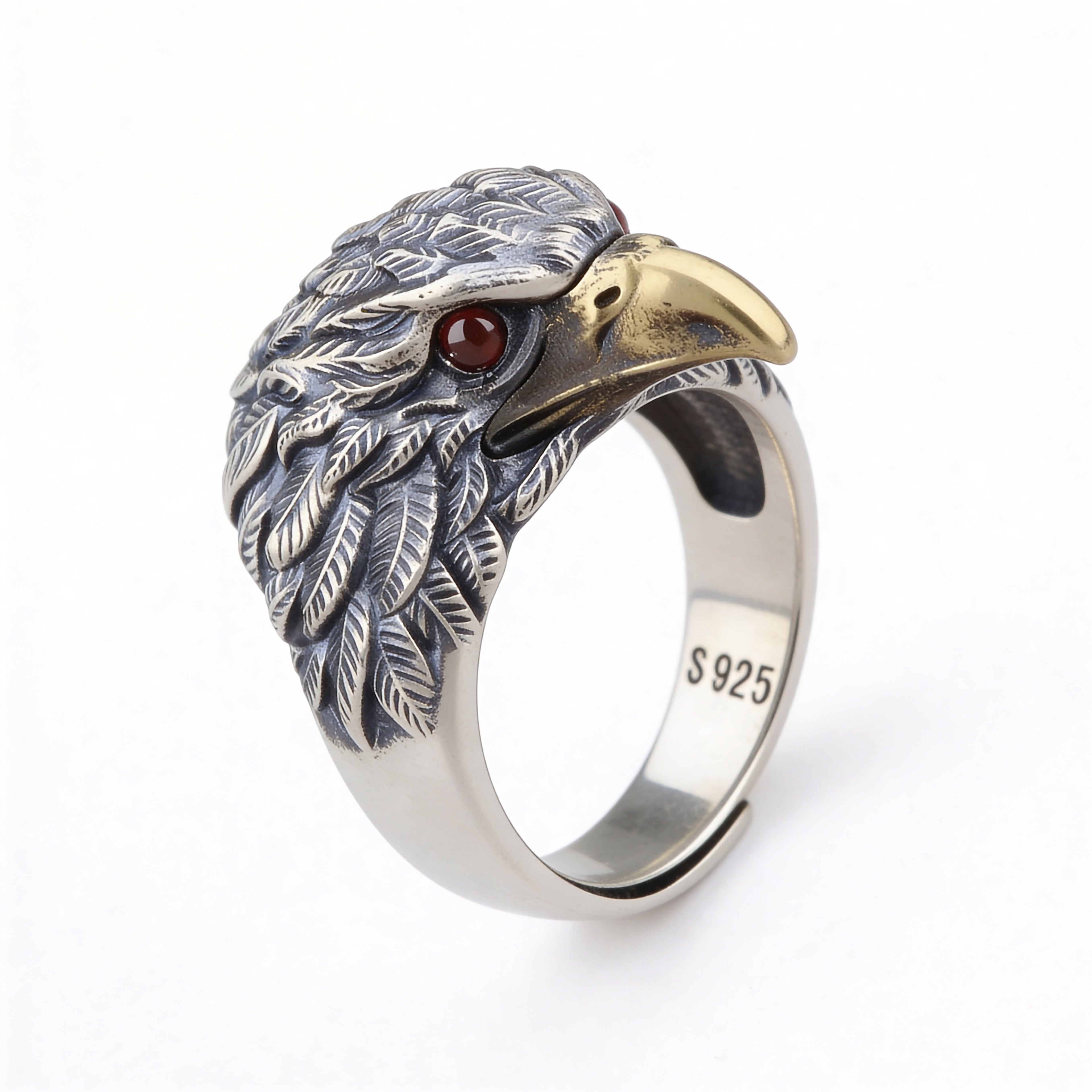 Silver plated eagle head adjustable ring with red stone eyes and detailed feather design.