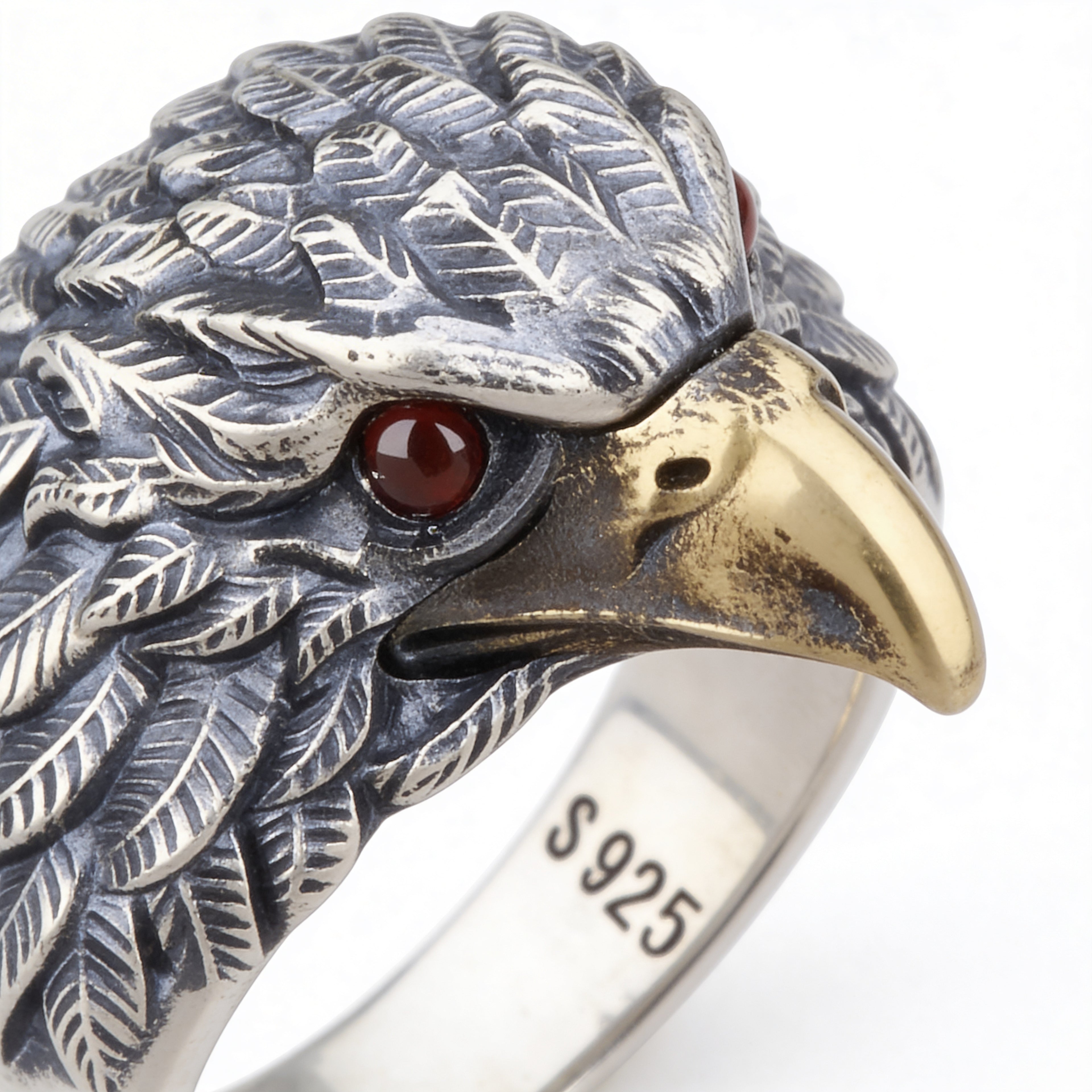 Adjustable silver eagle statement ring with red eyes on white backdrop
