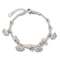 Silver plated leaf charm bracelet with bead accents.