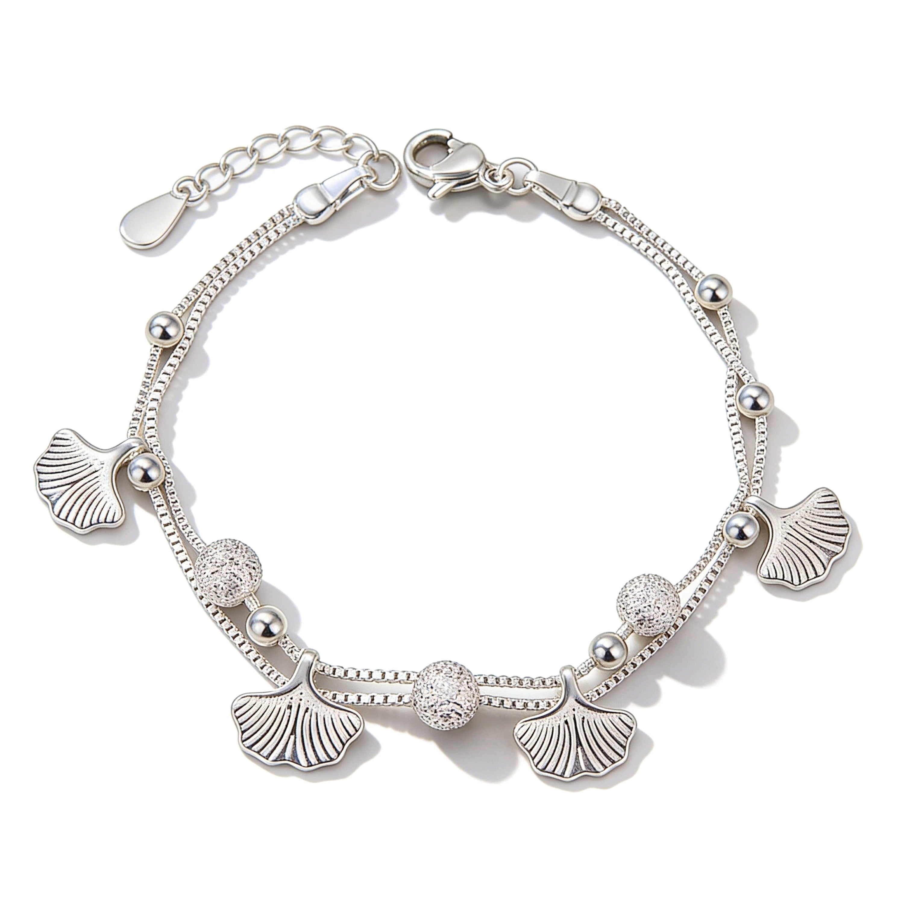 Silver plated leaf charm bracelet with bead accents.