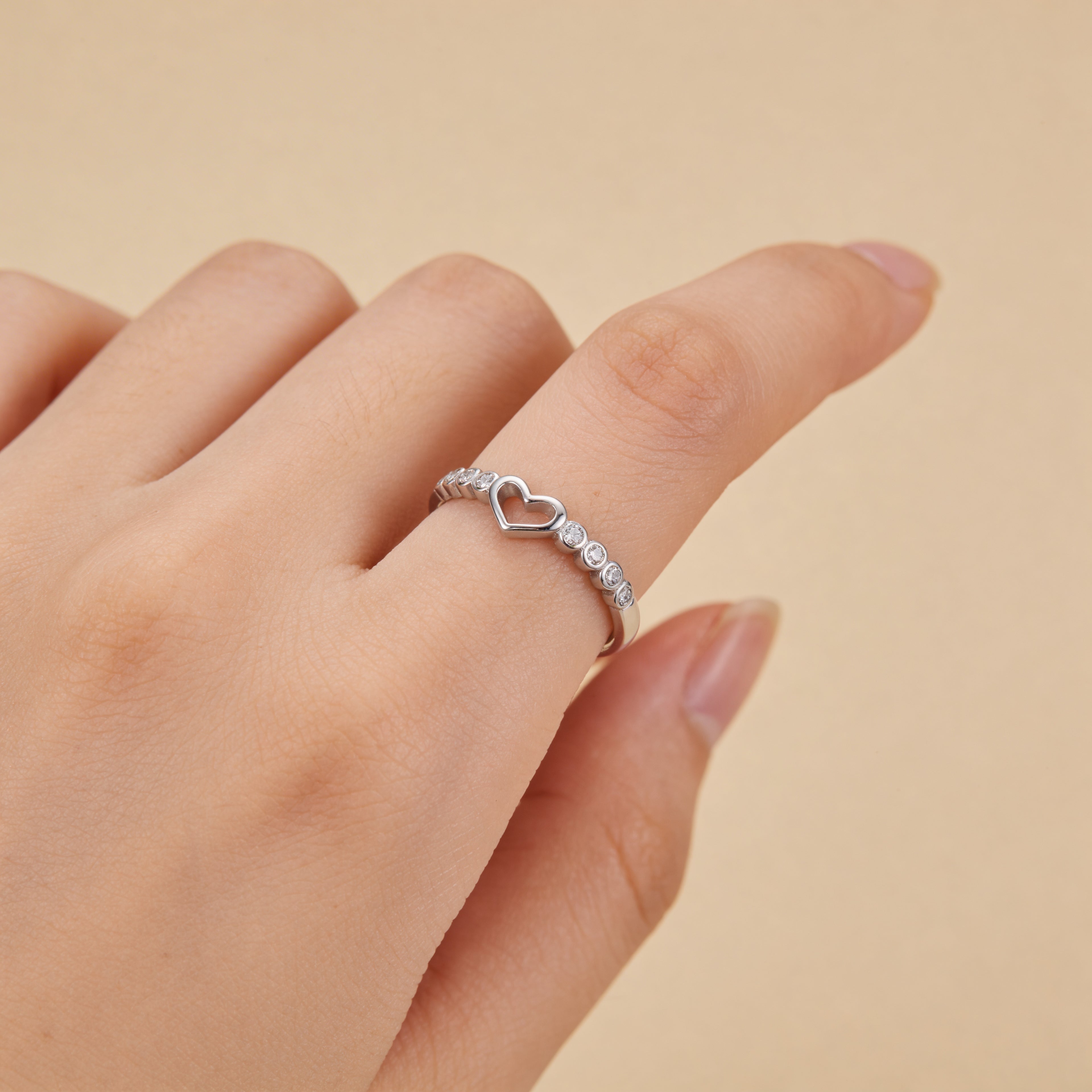 Adjustable silver heart ring with round CZ accent stones, minimalist promise ring for women, cute anniversary or Valentine’s gift.