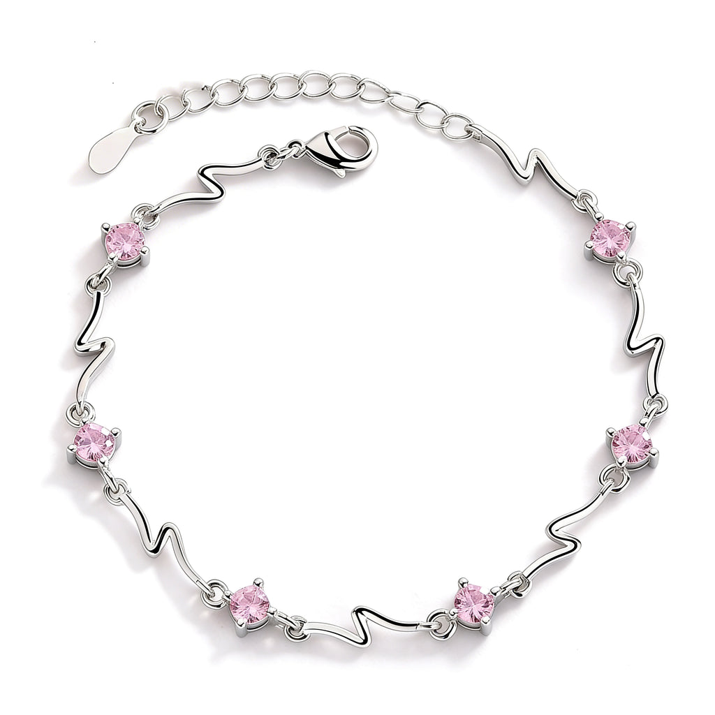 Silver plated pink crystal charm bracelet with light pink stones.
