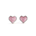 Silver plated pink heart stud earrings with glitter finish.