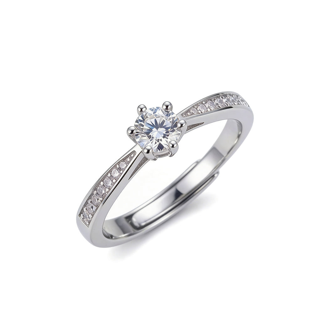 Silver plated adjustable solitaire ring with round cubic zirconia and pavé band detailing.