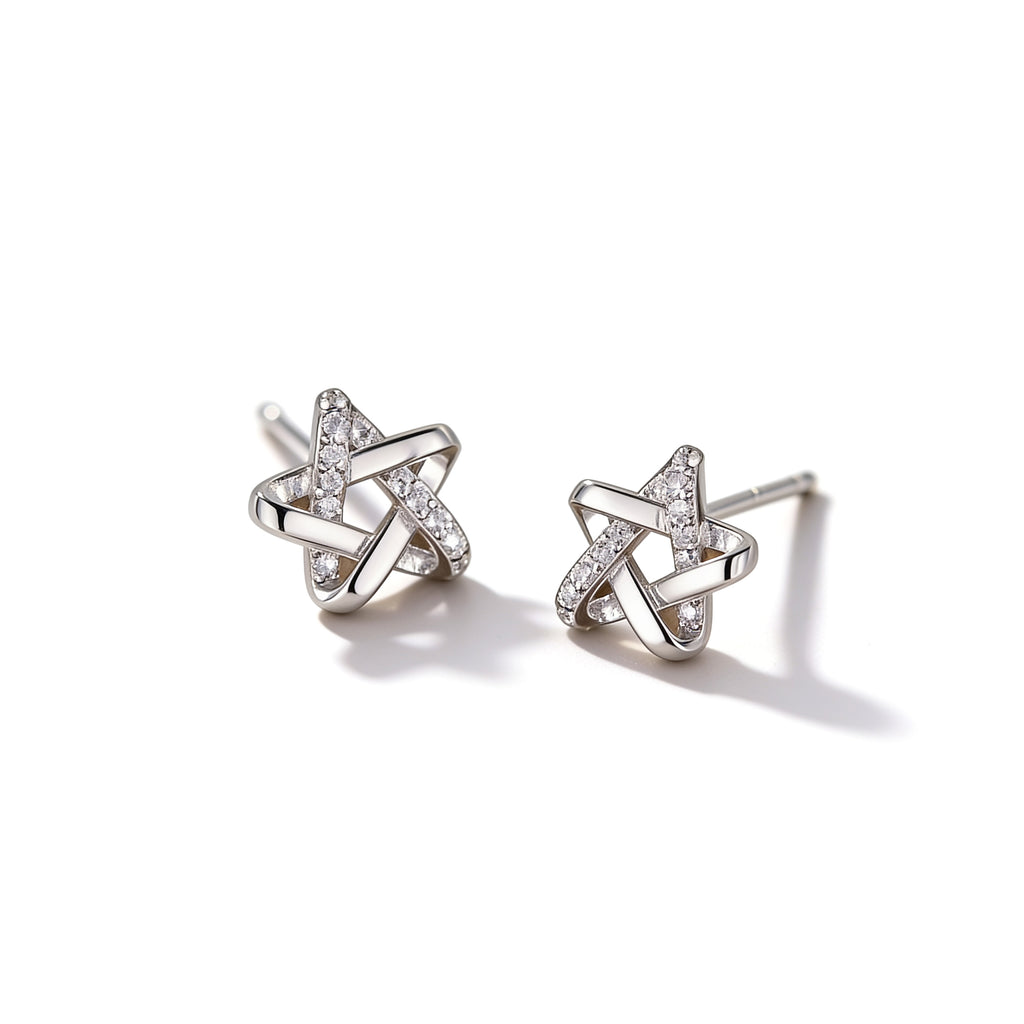 Silver plated star stud earrings with sparkling crystal accents on a white background