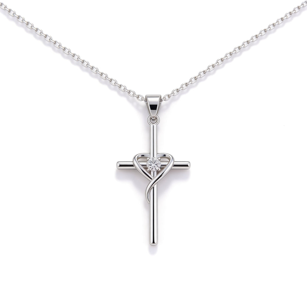 Silver plated ribbon cross pendant necklace with crystal detail.