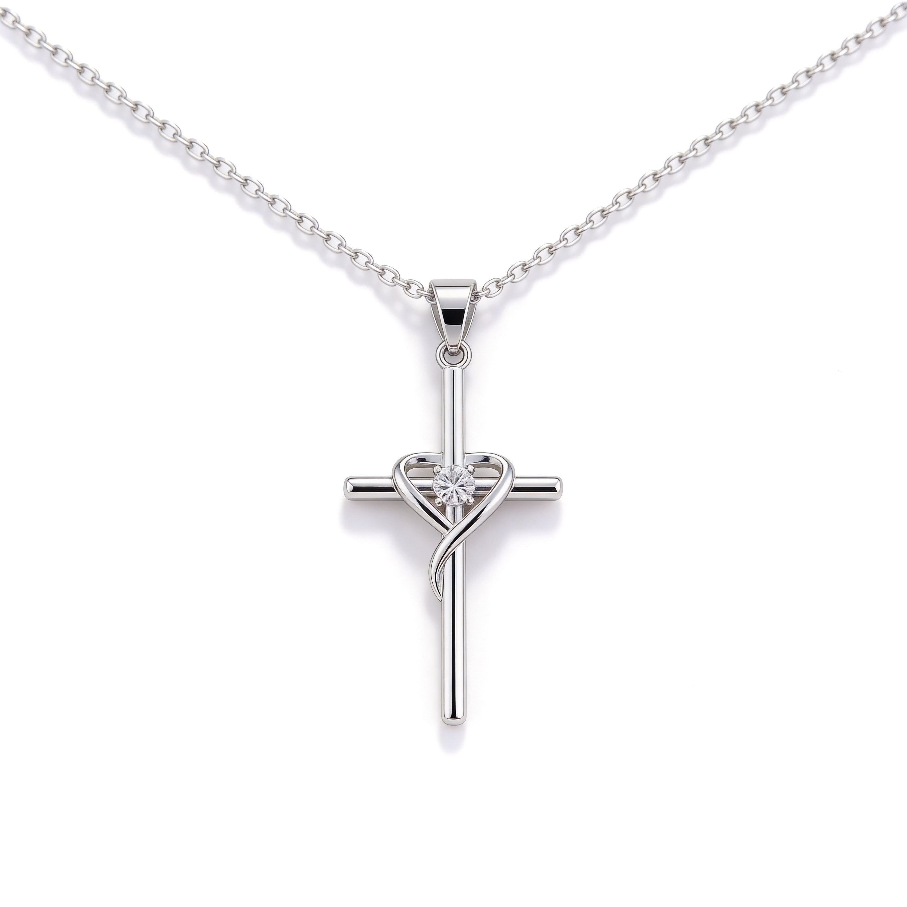 Silver plated ribbon cross pendant necklace with crystal detail.