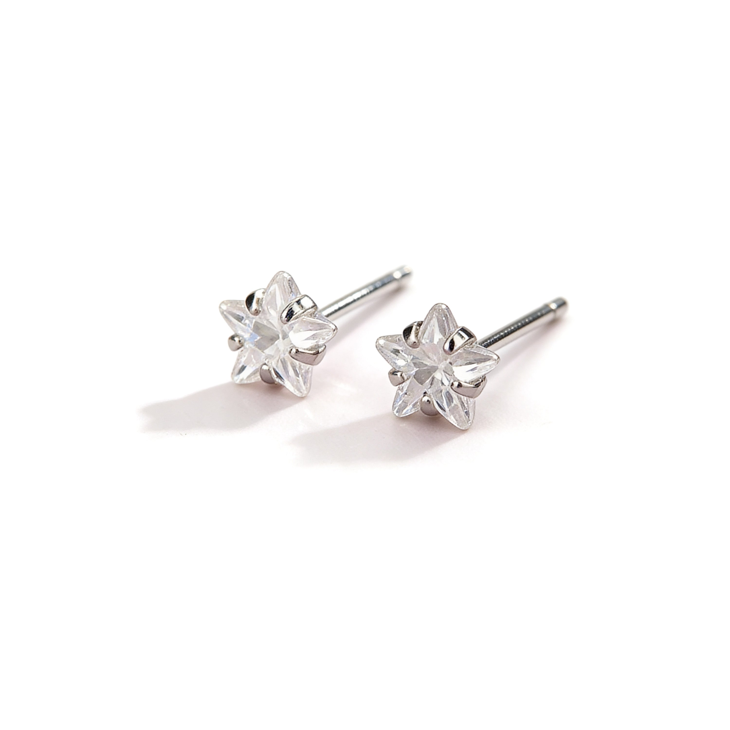Tiny silver plated crystal star stud earrings.